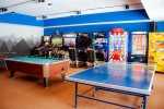 Game Room with pool table, ping pong, and Arcade Cabinets 